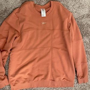 New!! Reebok Round Neck Long Sleeve Sweatshirt. No tags. Size XXL Canyon Coral